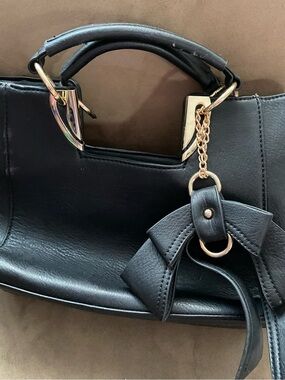 Black Bow Charm Wristlet Clutch with Gold Accents